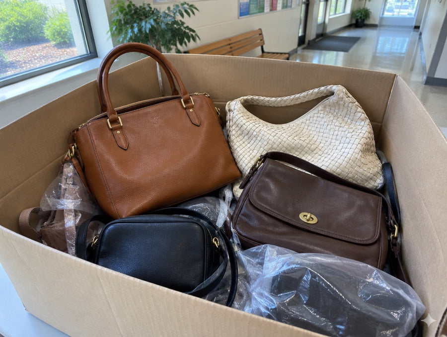 Donation box with returned handbags